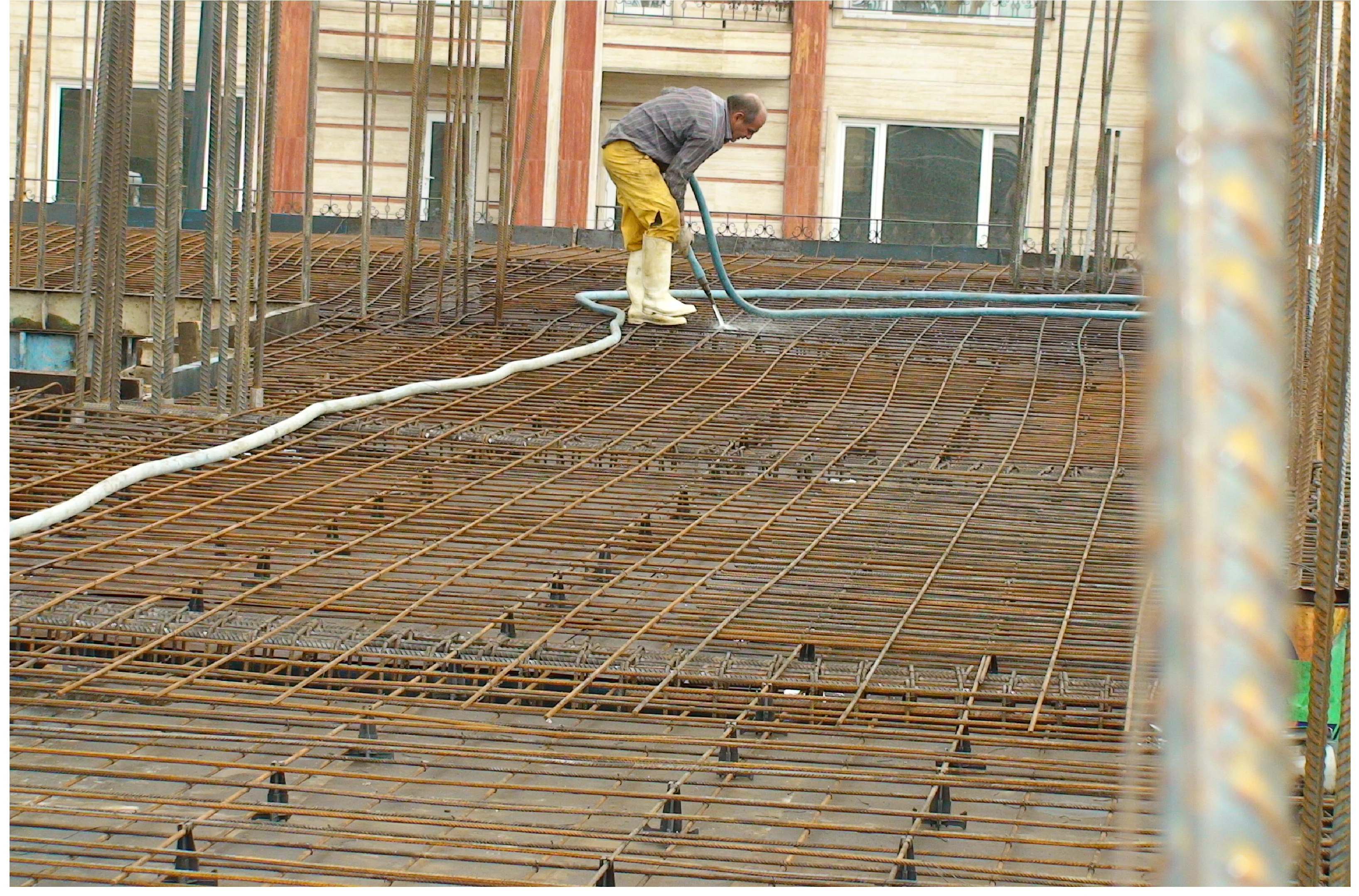 Tie wire collected with a magnet and formwork surfaces washed before concrete pouring.