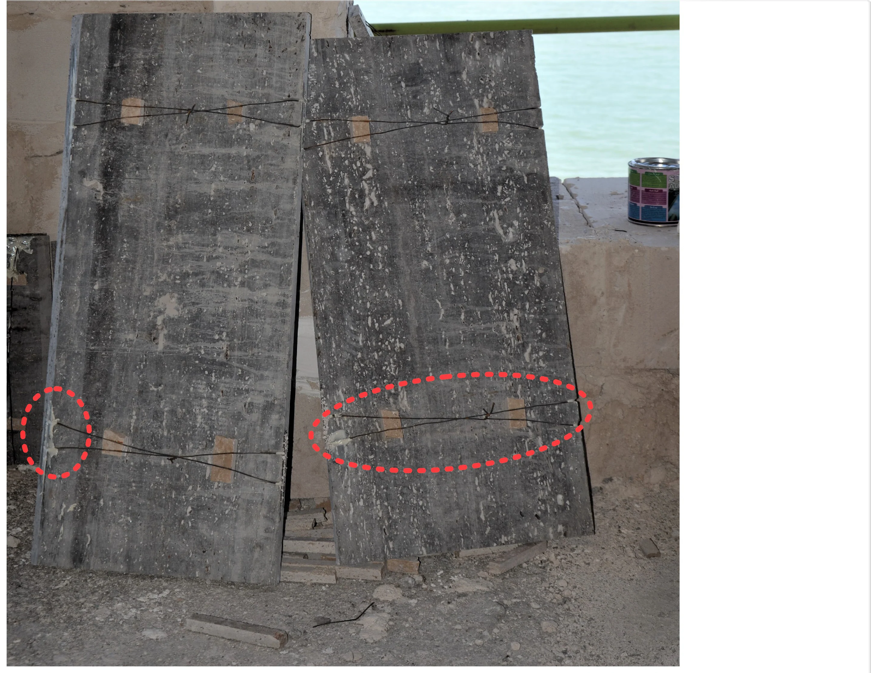 Facade stone ties installed — the cut edge of the stone filled with stone adhesive.